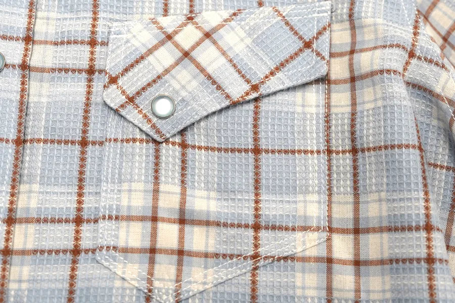Close-up of a Journal Western shirt showing the snap-flap chest pockets.